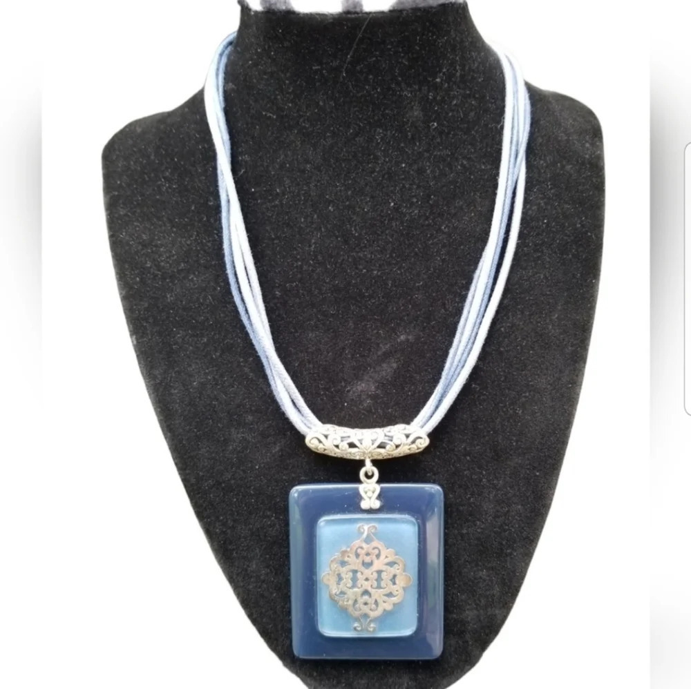 VINTAGE BLUE LUCITE PENDANT WITH SILVERTONED DETAIL  CORD NECKLACE
